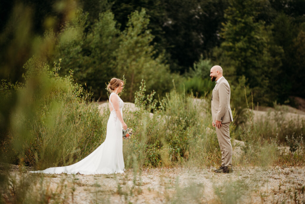 Wedding couple laughing in nature, approaching each other in nature.